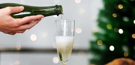 Banner bollicine versate calice Champagne