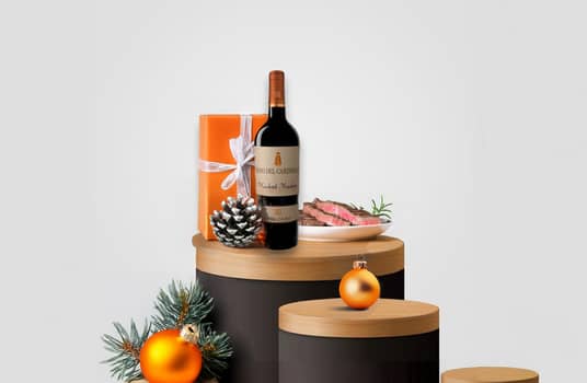 red wine for christmas with gift in backround